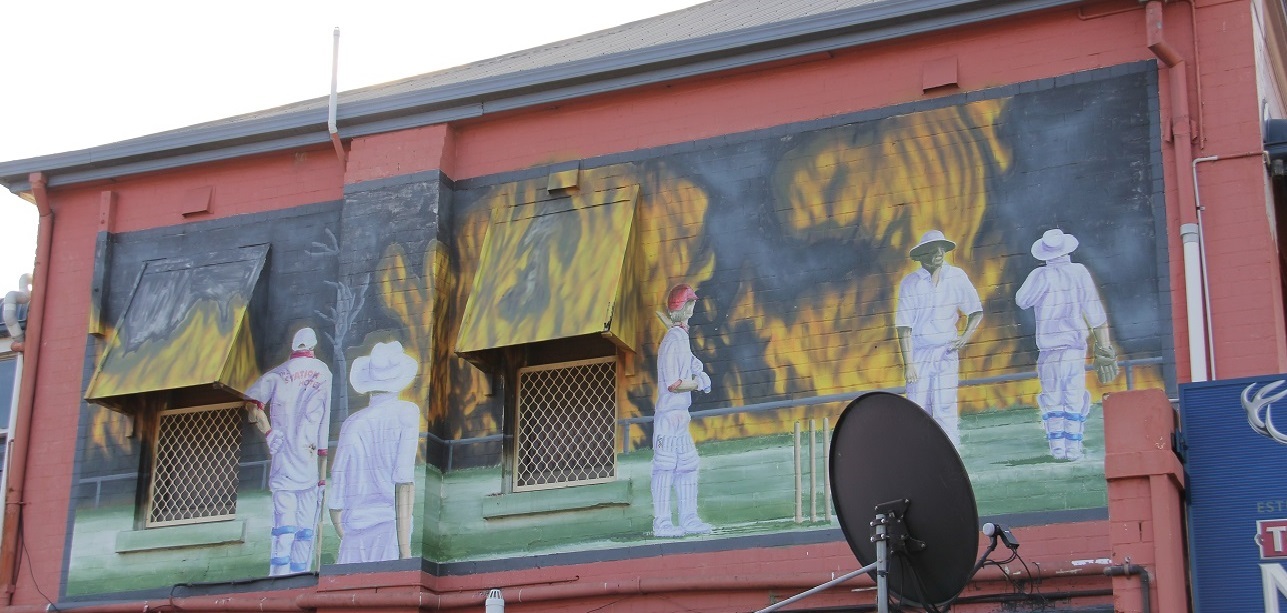 KK mural cricketers and fire.JPG