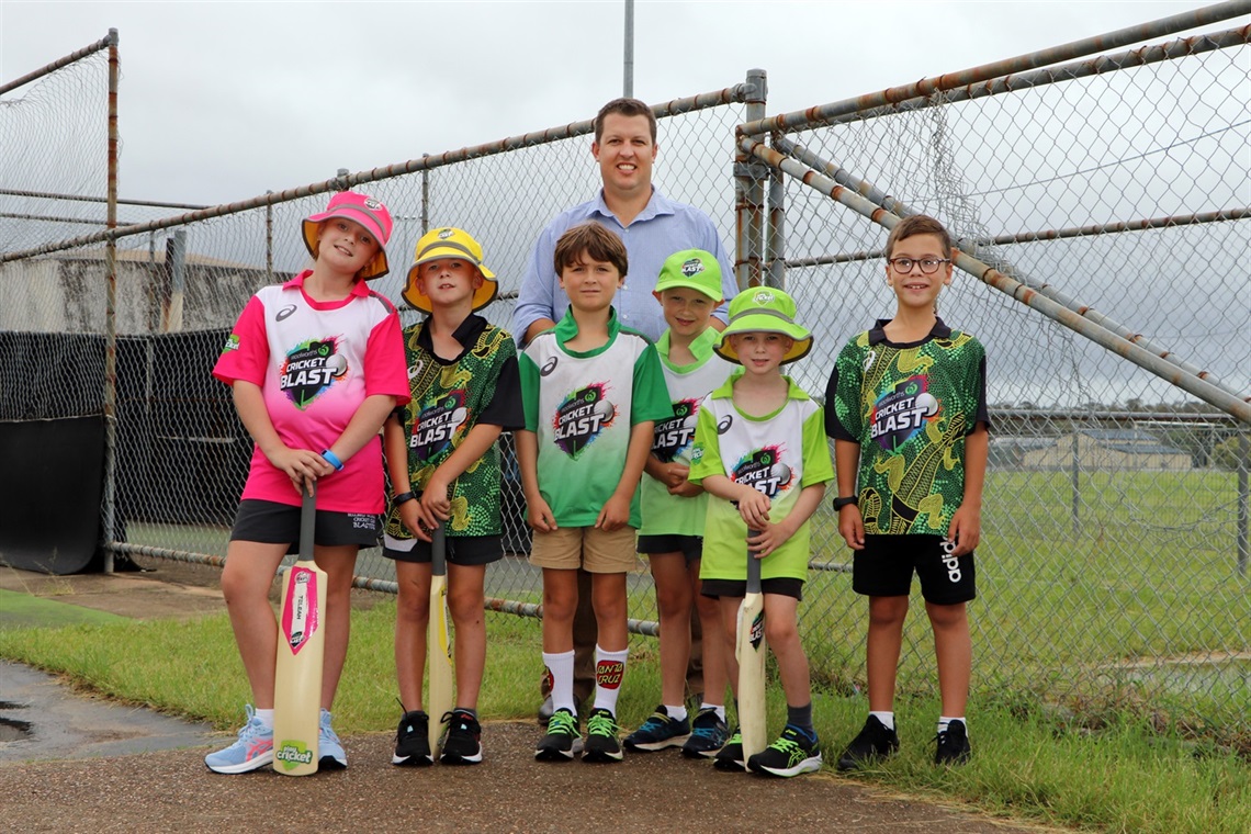 Cessnock City Mayor Jay Suvaal with the Bellbird Blasters under 11s cricket team at the existing site of the Carmichael Park cricket nets