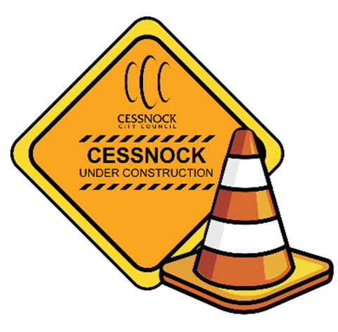 Image of a construction sign and traffic cone