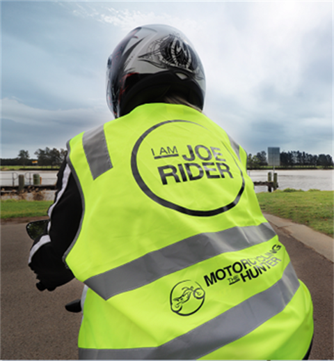 Image of motorcyclist in high visibility vest