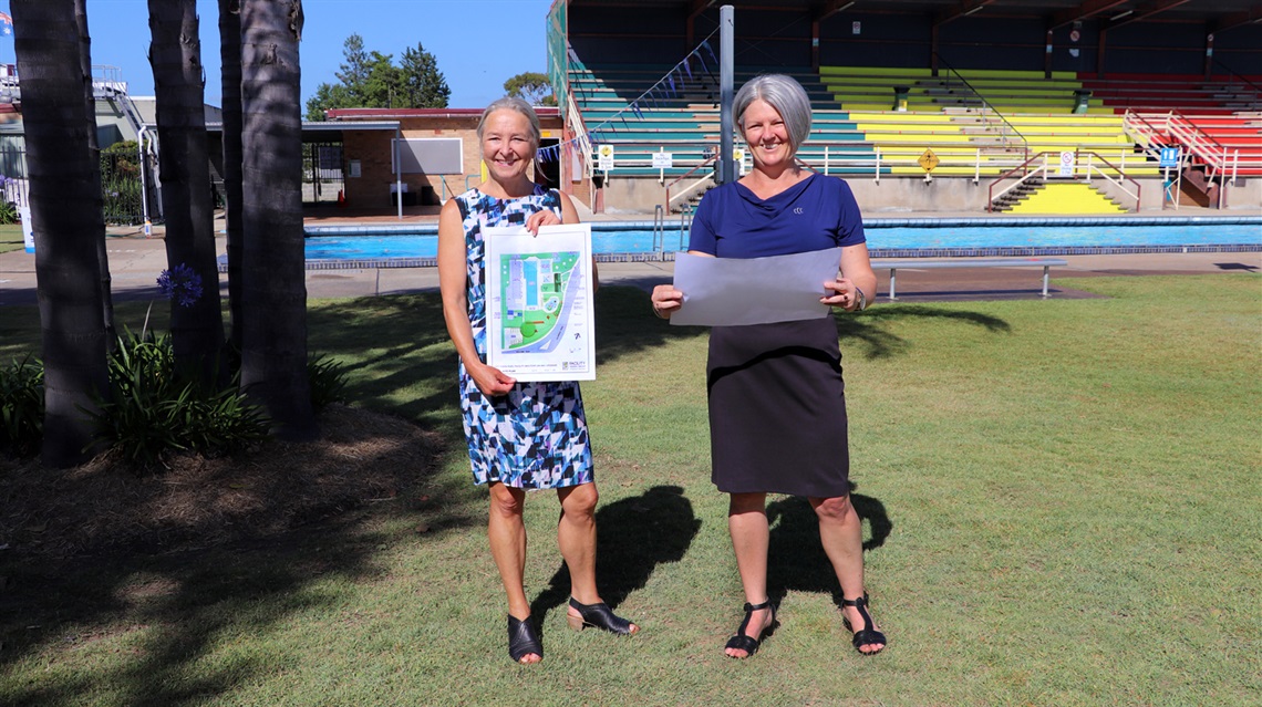 General Manager Lotta Jackson and Manager of Open Space and Community Facilities Nicole Benson pictured at Cessnock Pool looking at plans for the splash pad.