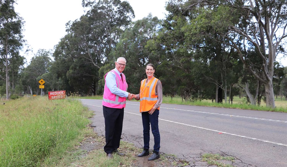 The image features Cessnock City Mayor, Councillor Bob Pynsent and NSW Senator Perin Davey at Sandy Creek Road, Quorrobolong for the announcement. 
