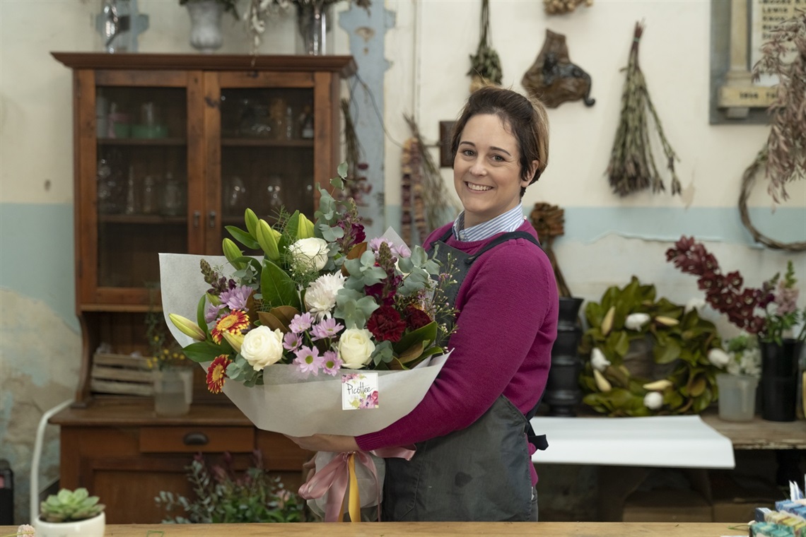 A photo of Brie the Founder and Creative Director at Picottee Floral – a business based in Greta. Photo Credit- Trish Evans. 