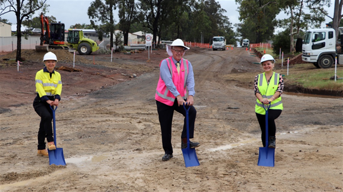 Image of Council’s General Manager Lotta Jackson, Cessnock City Mayor, Councillor Bob Pynsent and Director Region North for Transport for NSW Anna Zycki participating in a sod turn.