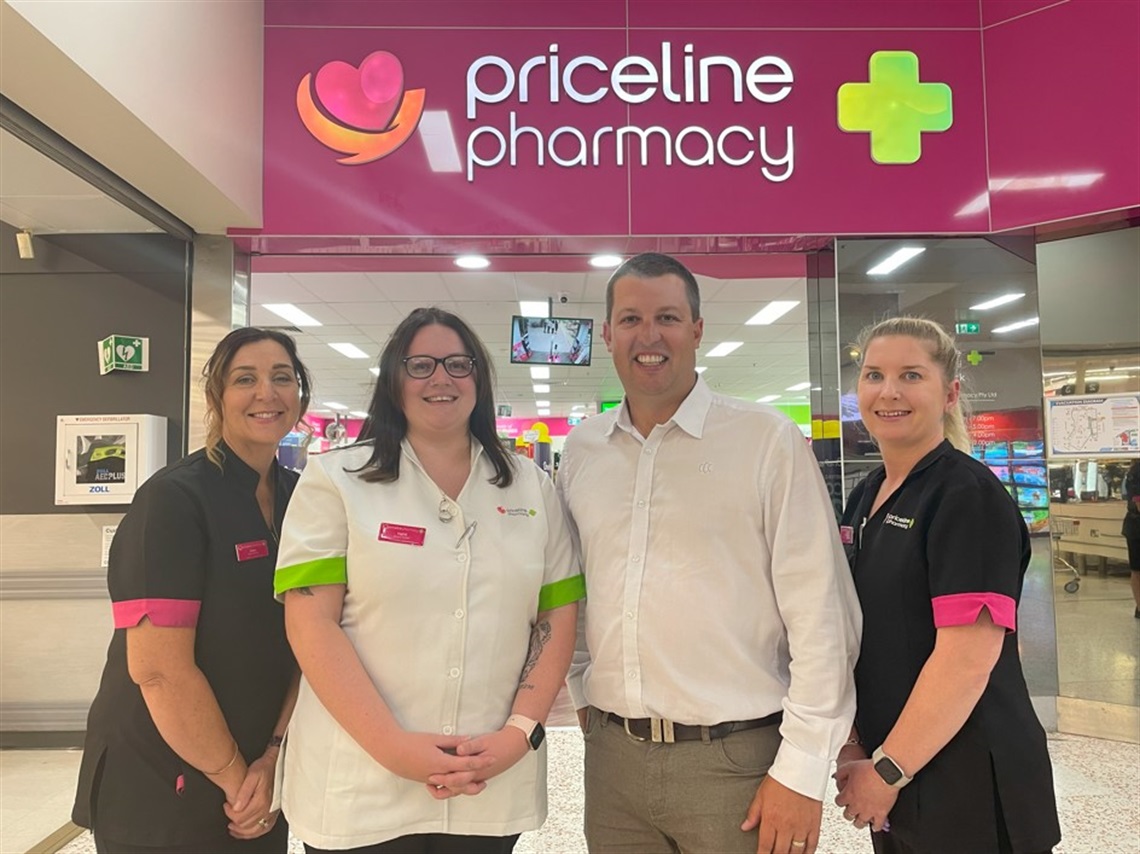 Cessnock City Mayor Jay Suvaal standing in front of Priceline Pharmacy with Priceline employees