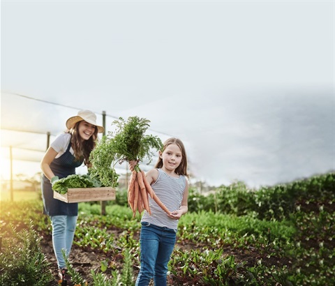 iStock-1097881642_woman and child in garden growing vegetables_EXT.jpg